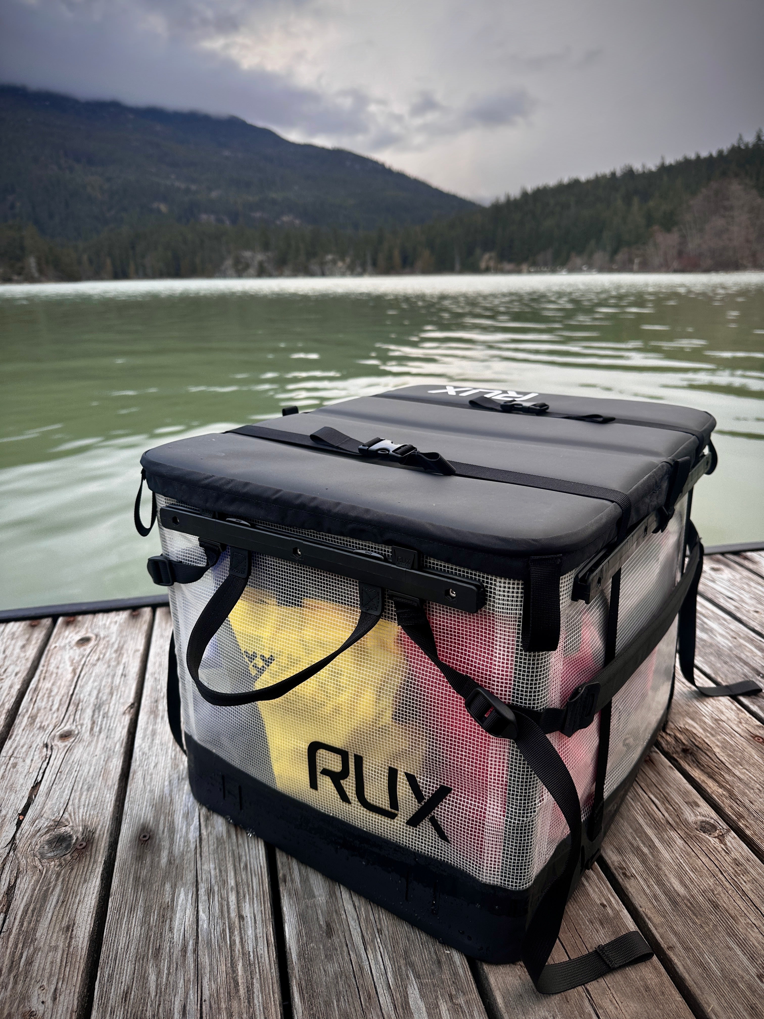 The weatherproof RUX 70L Clear on a dock in Whistler, BC. 