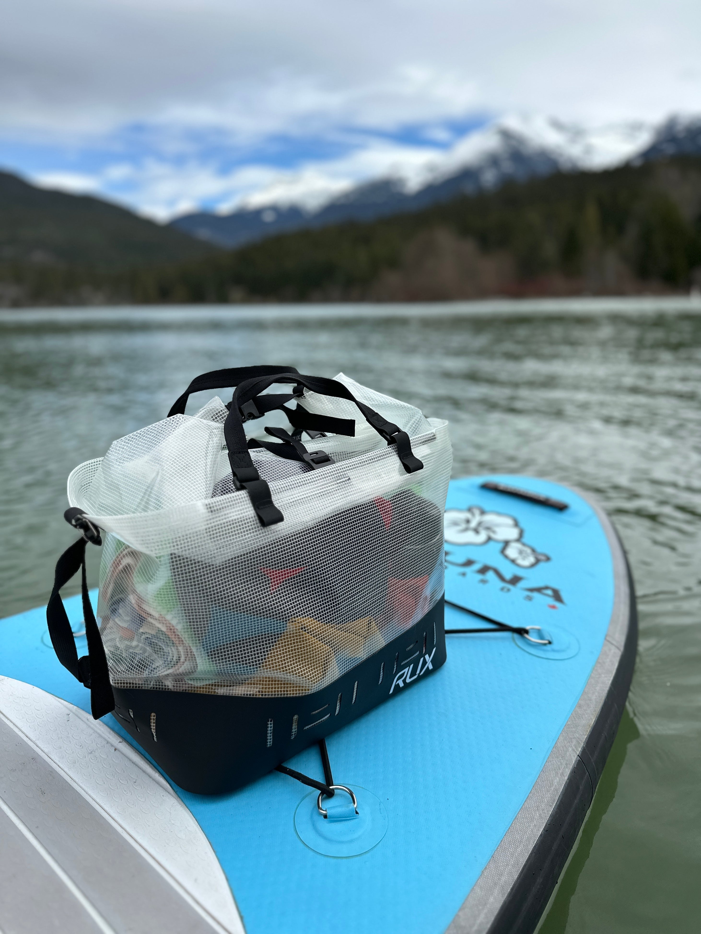 RUX Waterproof Bag Clear on a standup paddle board in Whistler, BC.