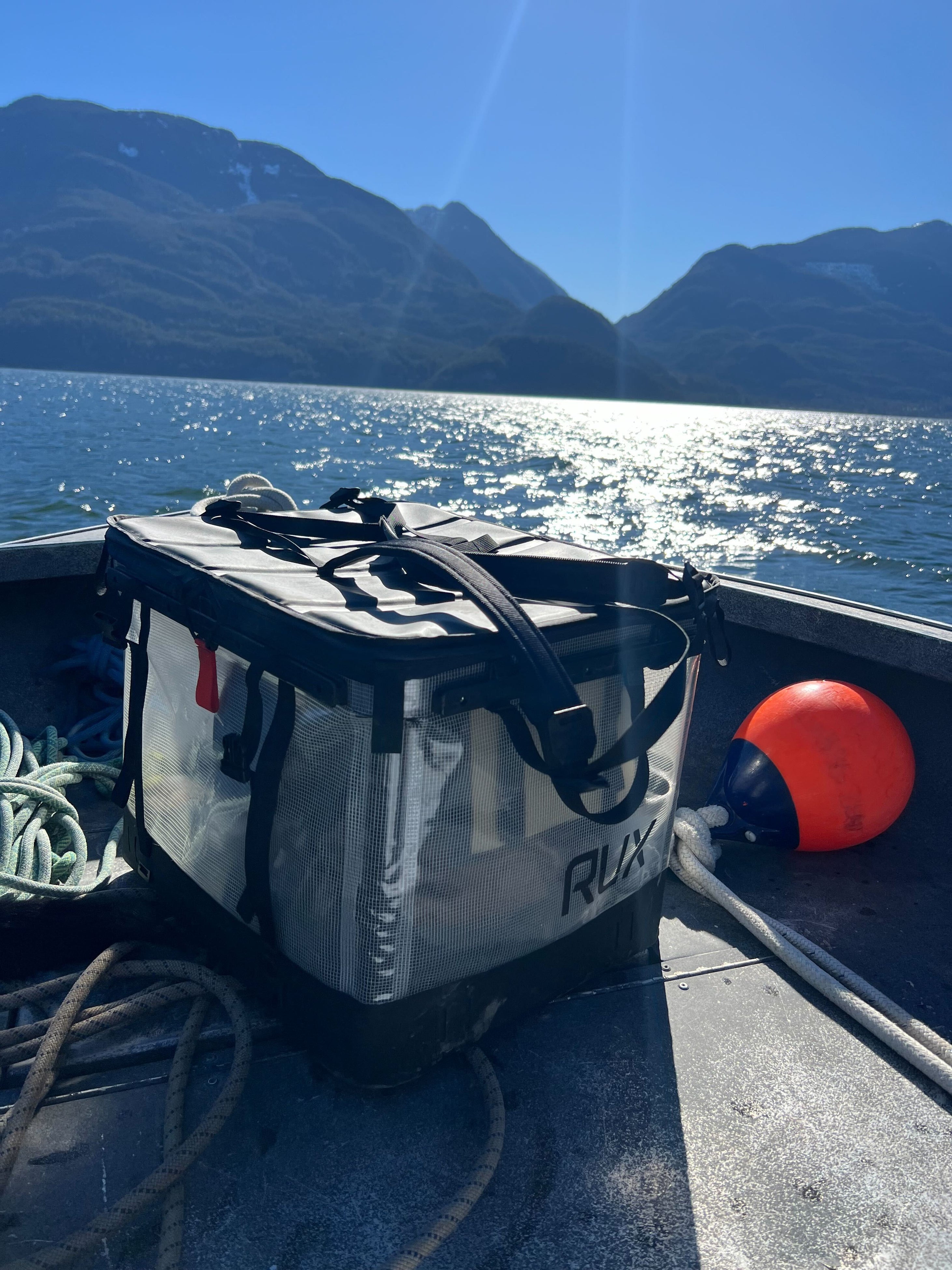 The weatherproof RUX 70L Clear on a boat in Howe Sound, Squamish, BC